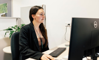 Woman at desk using computer