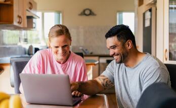 Couple looking at a laptop
